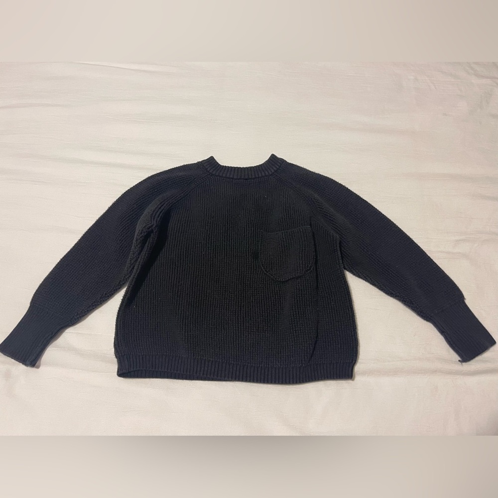 Boys black sweater size 2-3. Small imperfection shown in picture.